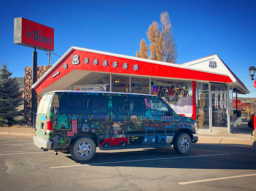van in front of route 66 diner - how to choose vehicle for roadtrip
