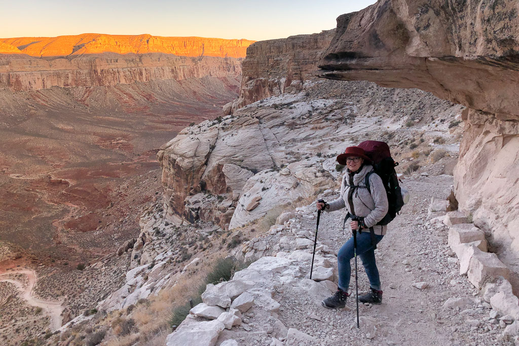 Havasupai packing list: Agnes hiking to Havasu Falls with deuter backpack and with trekking poles.