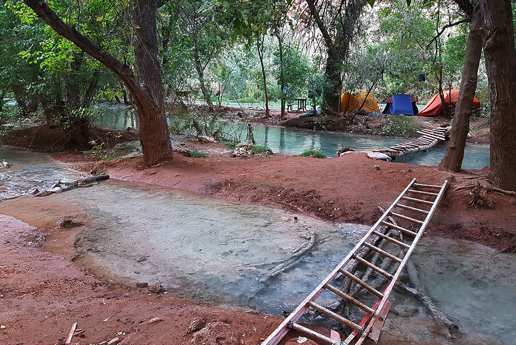 bridges and tents along the river in havasu falls camping.