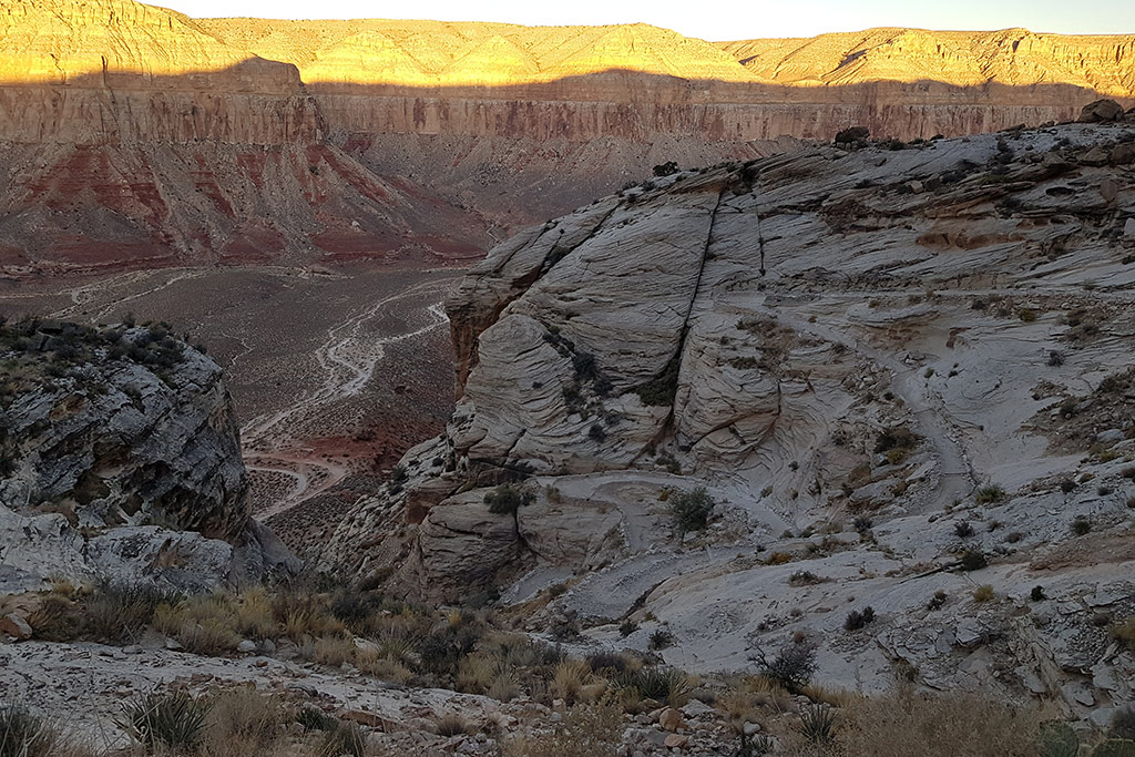 Havasu falls hike from the hilltop - a narrow path leading down the canyon through the desert.