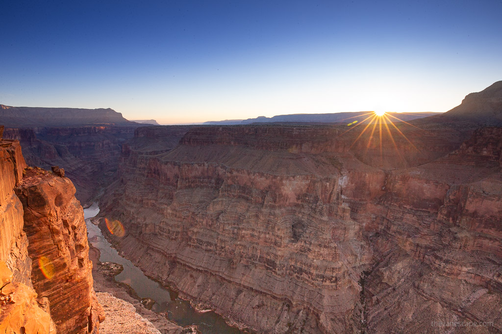 Colorado River and orange rock durin sunset at Toroweap overlook in Arizona.