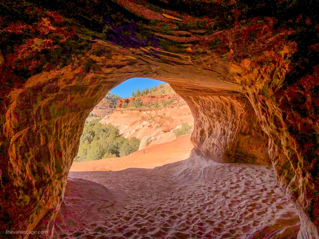 orange walls inside the Moqui Caverns.