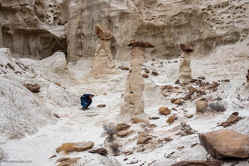 Chris Labanowski, c0-founder of the Van Escape blog is taking pictures of hoodoo in Paria Rimrock Toadstool Hoodoos.