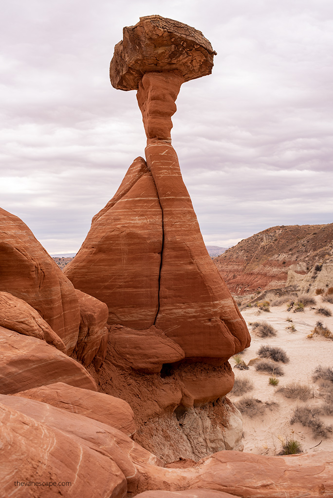 The orange hoodoo looks like a mushroom.