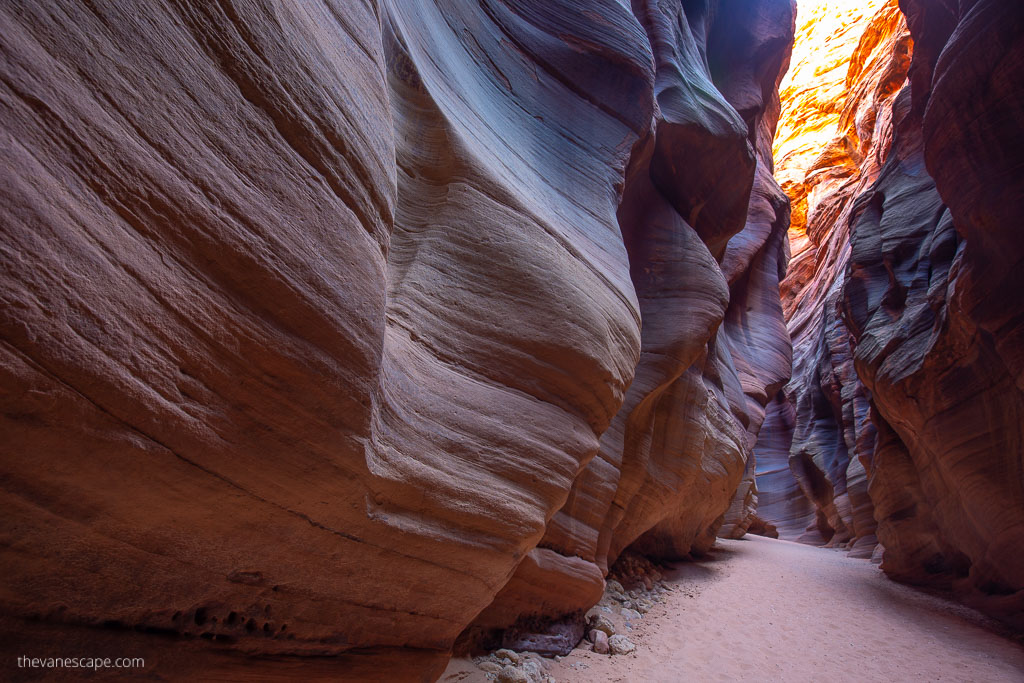 narrow oranges rock formations in slot canyon during buckskin gulch day hike.