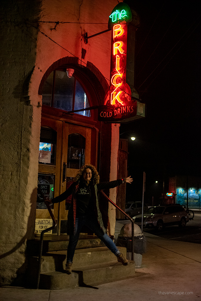 Agnes Stabinska, the author, at the entrance to the The Brick Roslyn Bar.