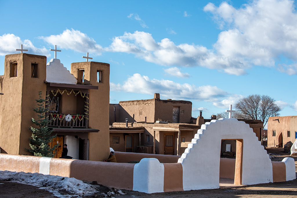 Taos Pueblo Church with Christmas tree at the front door.