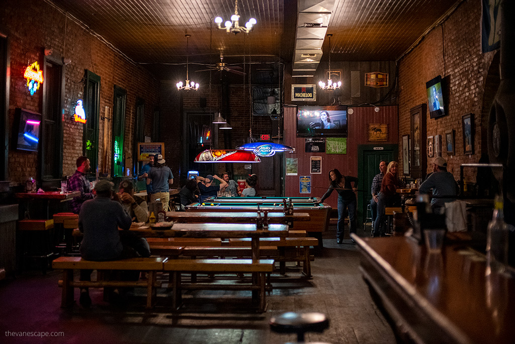 people and bar inside the The Brick Roslyn.