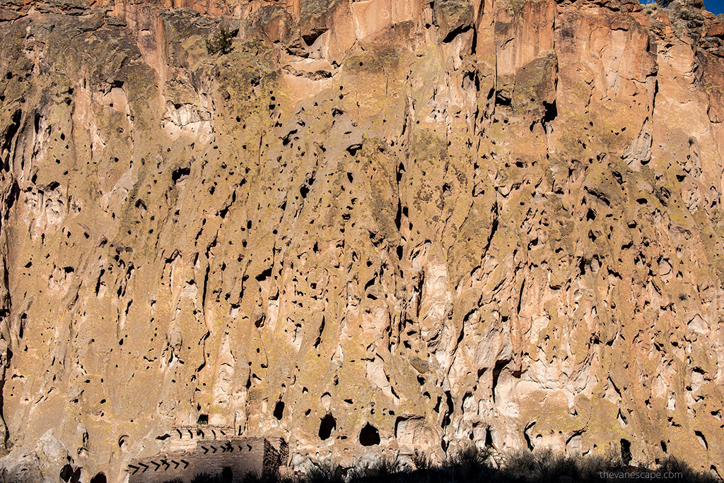 old houses carved in rock walls in Bandelier.