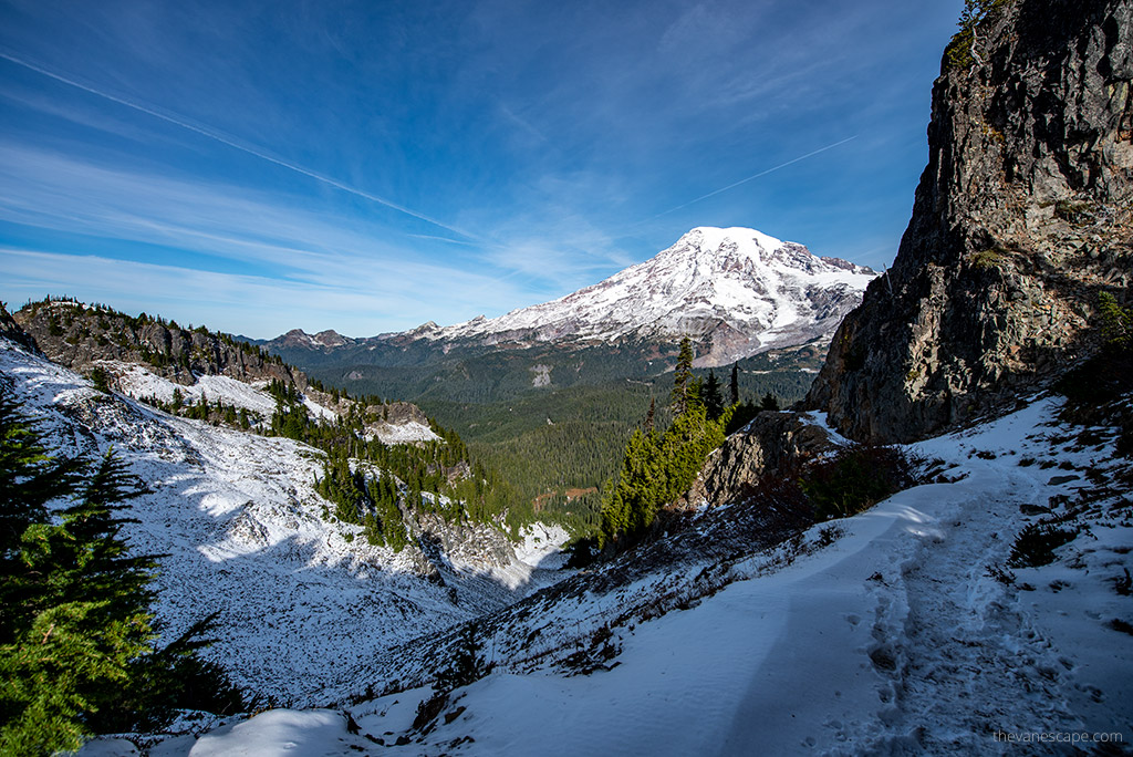 hiking trail with the Mount Rainier view, the trail is covered by snow.