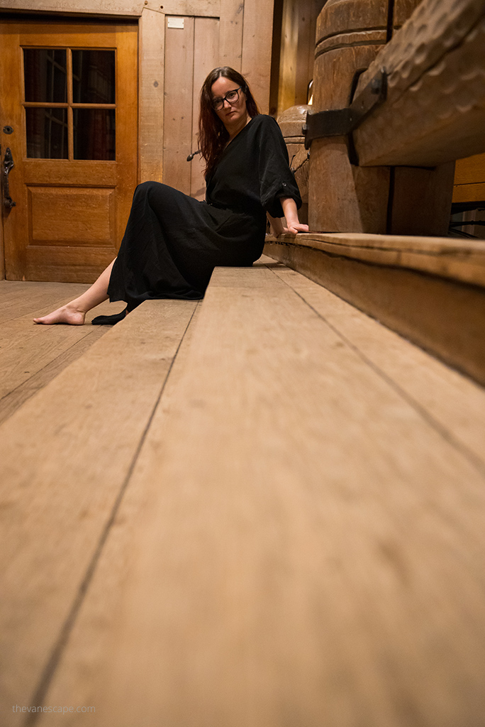 Agnes Stabinska, the author, is sitting on the woodenn stairs in Timberline Lodge.