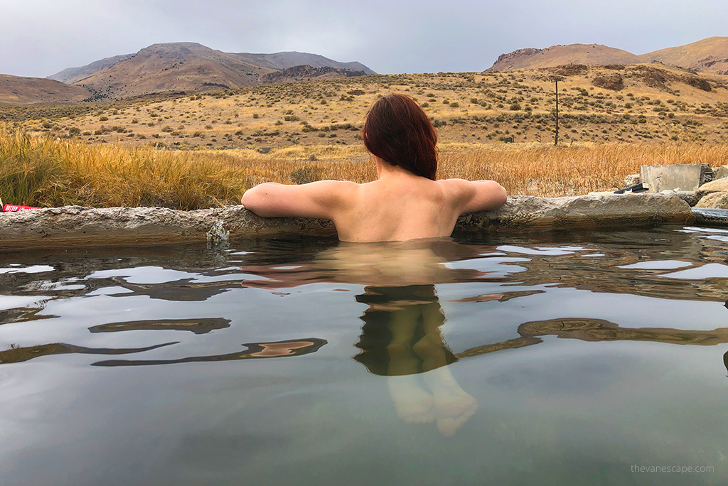 Agnes Stabinska, the author, soaking in Alvord Hot Springs and admiring mountain view.