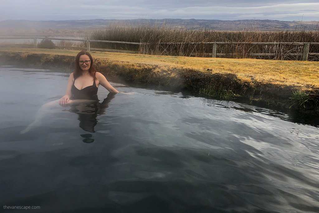 Agnes Stabinska, the author, is soaking in Crystal Crane Hot Springs, she is wearing black swimsuit. 