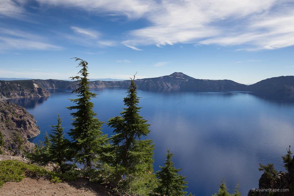 the view of the Crater Lake from Rim loop: blue water and trees.