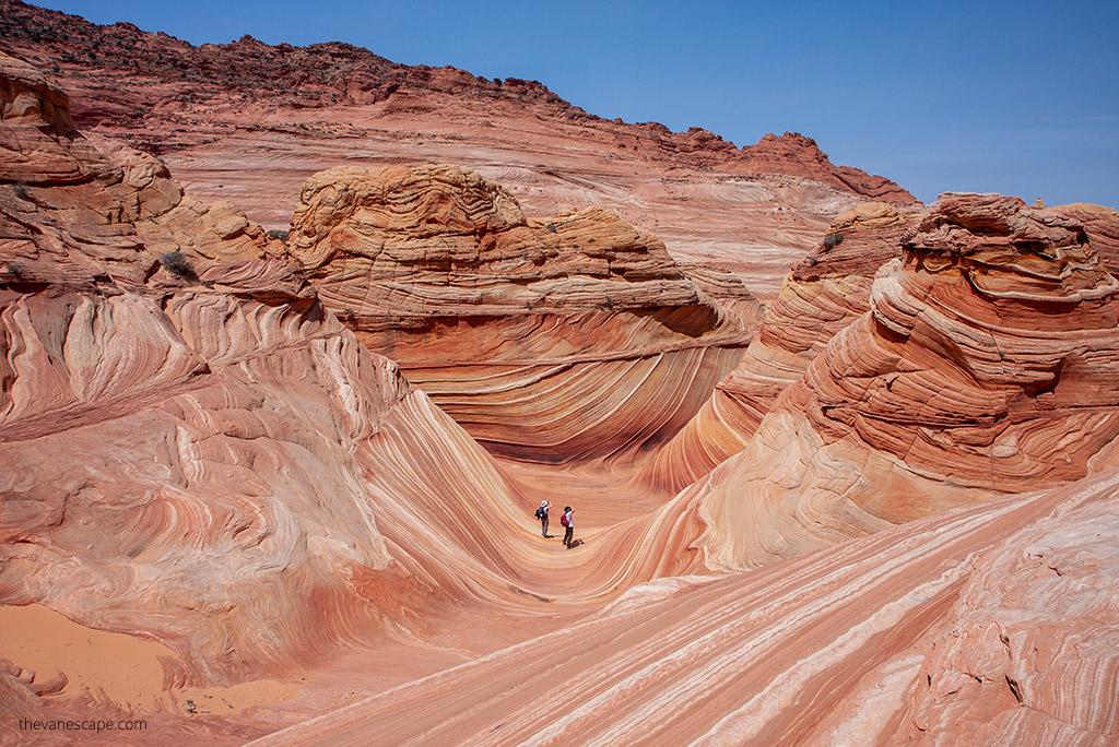 photographers taking pictures of the Wave formation during hike to the wave