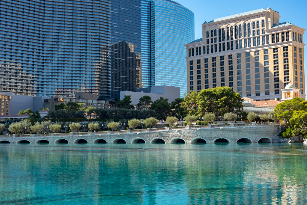 Las vegas hotel with blue water in fountain.