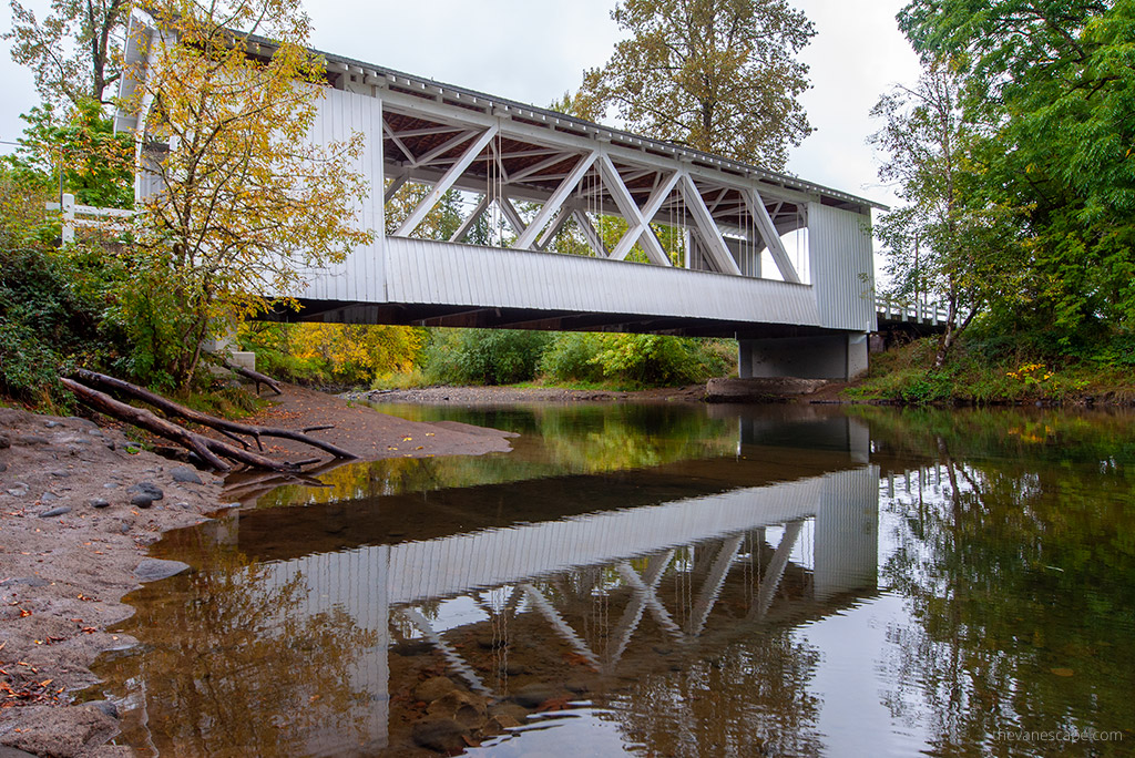 reflaction of Larwood Bridge in the water.