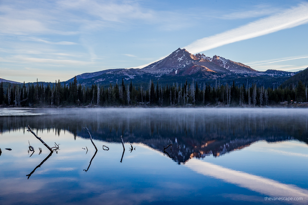 Sisters near Portland area: the reflaction of mountains and forest during sunrise on the lake near Sister.