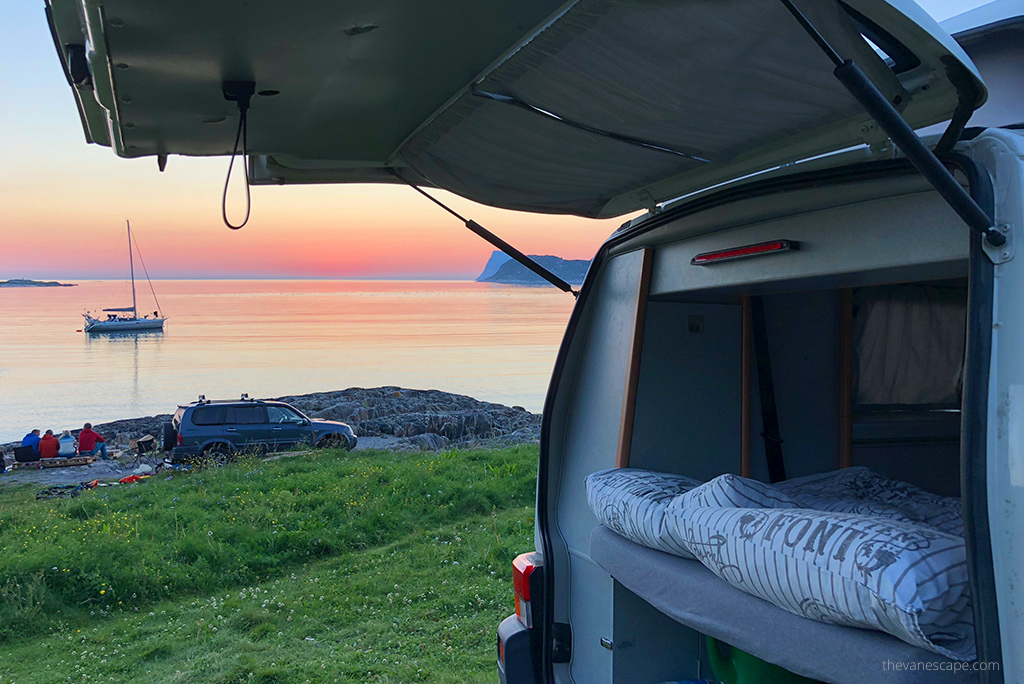 our van during road trip during sunset on the lake.