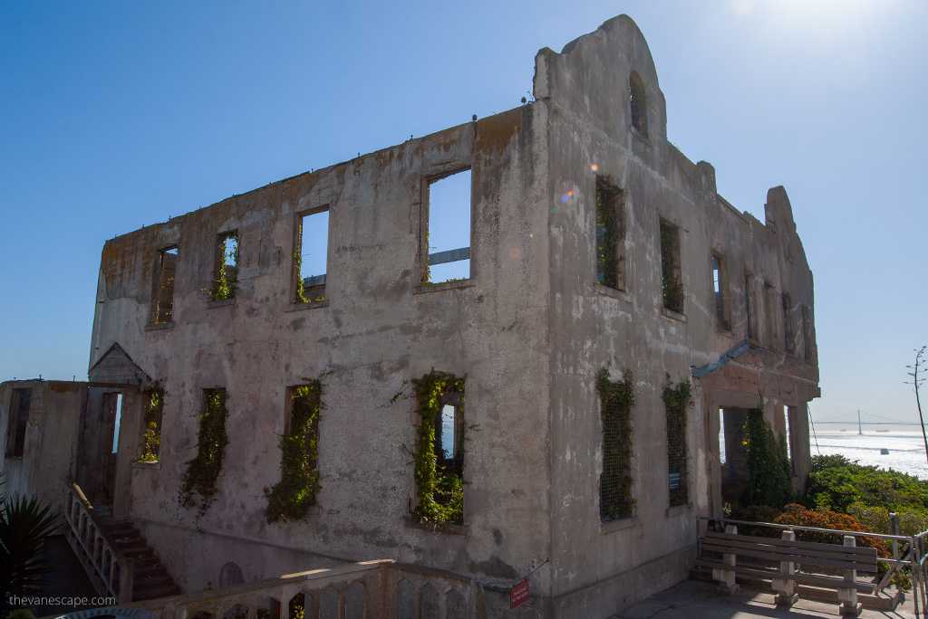 One of the old prison buildings destroyed and overgrown with grass.