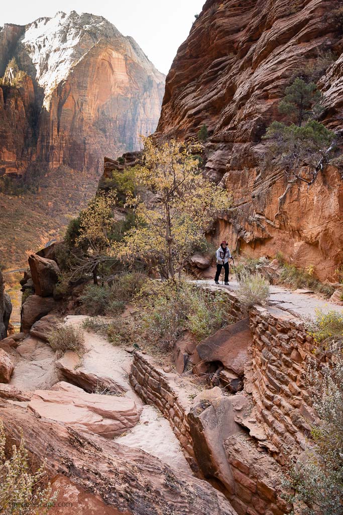 Agnes Stabinska, the author, on the Angels Landing hike. She is hiking with trekking poles in hands.