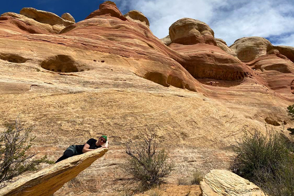 Agnes Stabinska, the author, is resting on the rock at Rattlesnake Arches.