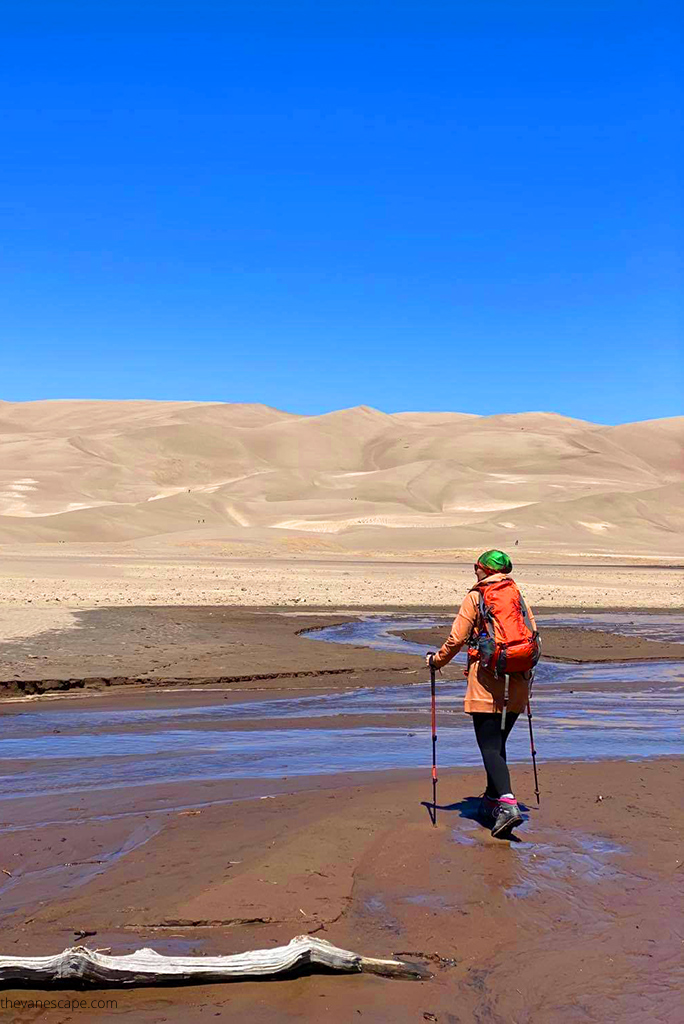 Agnes Stabinska, the author, is hiking in the Great Sand Dunes National Park.