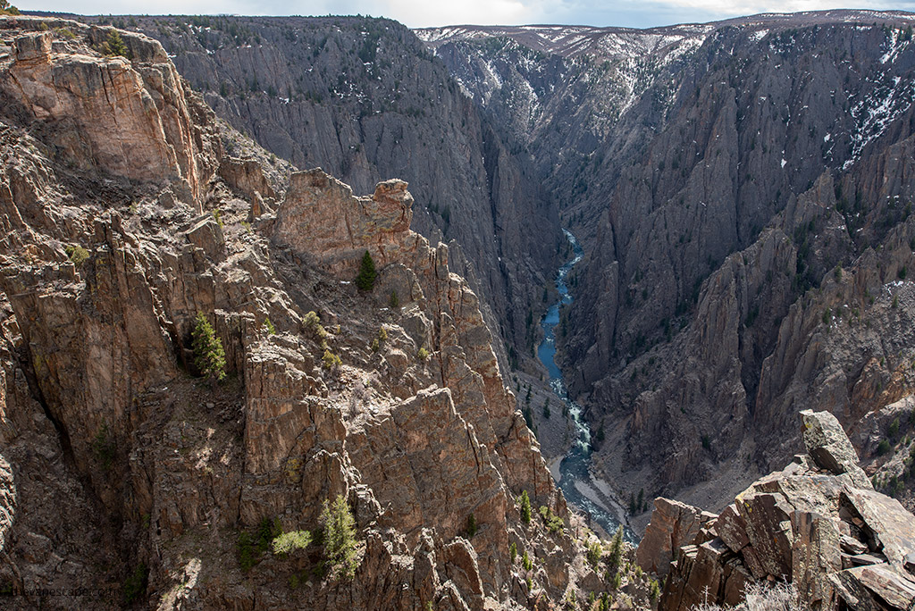 North Rim Road Drive in Black Canyon of the Gunnison National Park, during Colorado road trip: the view of the river and abyss.