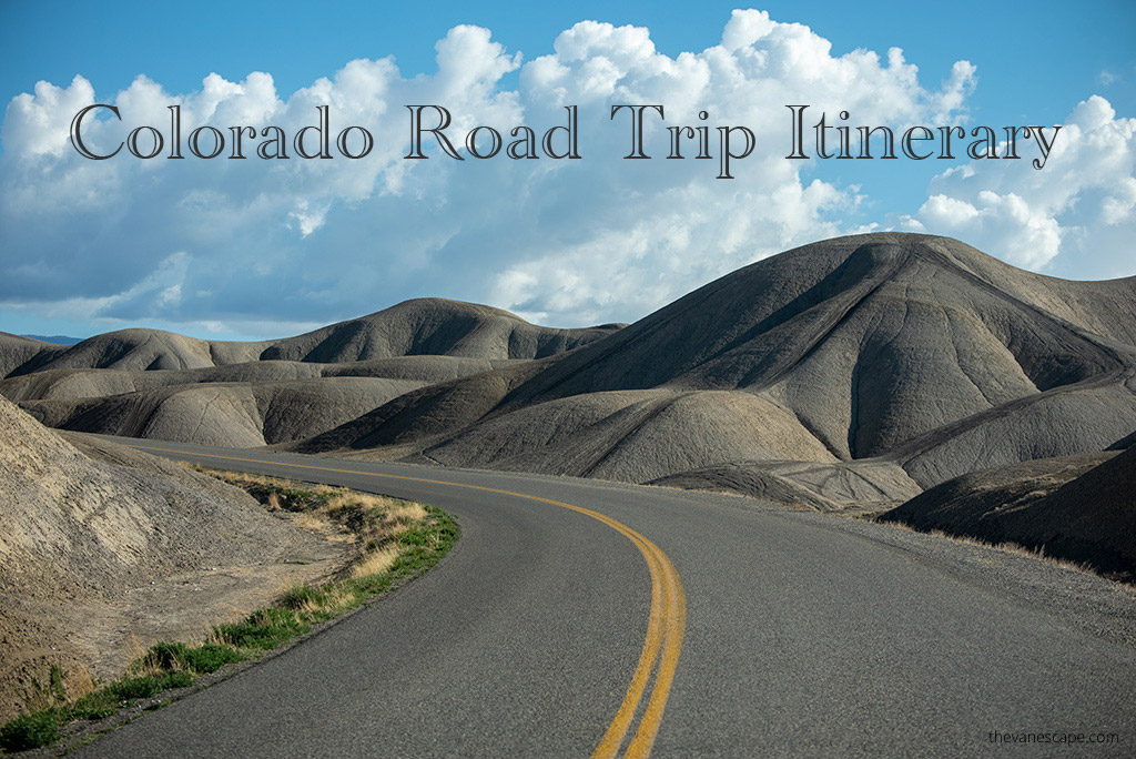 Stunning vita of the road among grey badlands and blue sky in Colorado with the inscription: Colorado Road Trip Itinerary.