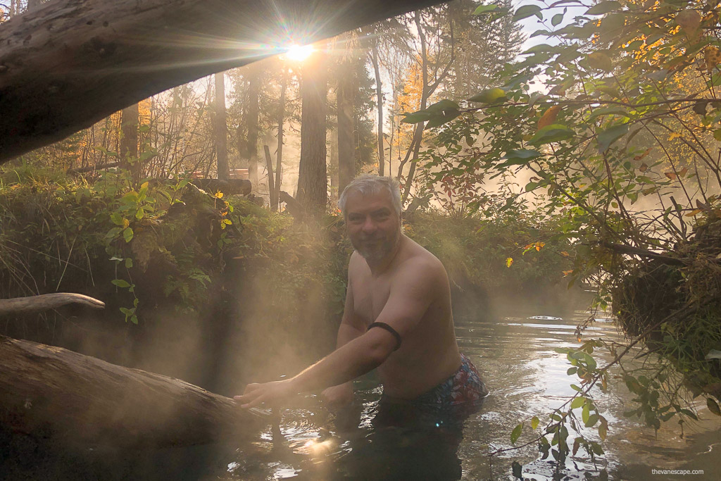 Chris Labanowski, co-founder of the Van Escape blog, is soaking in Liard River Hot Springs in morning fog.