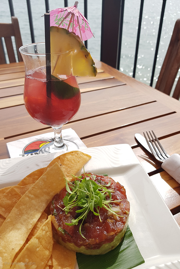 Our delicious lunch in Maui - a delicious drink and fresh tuna tartare with the sea in the background.