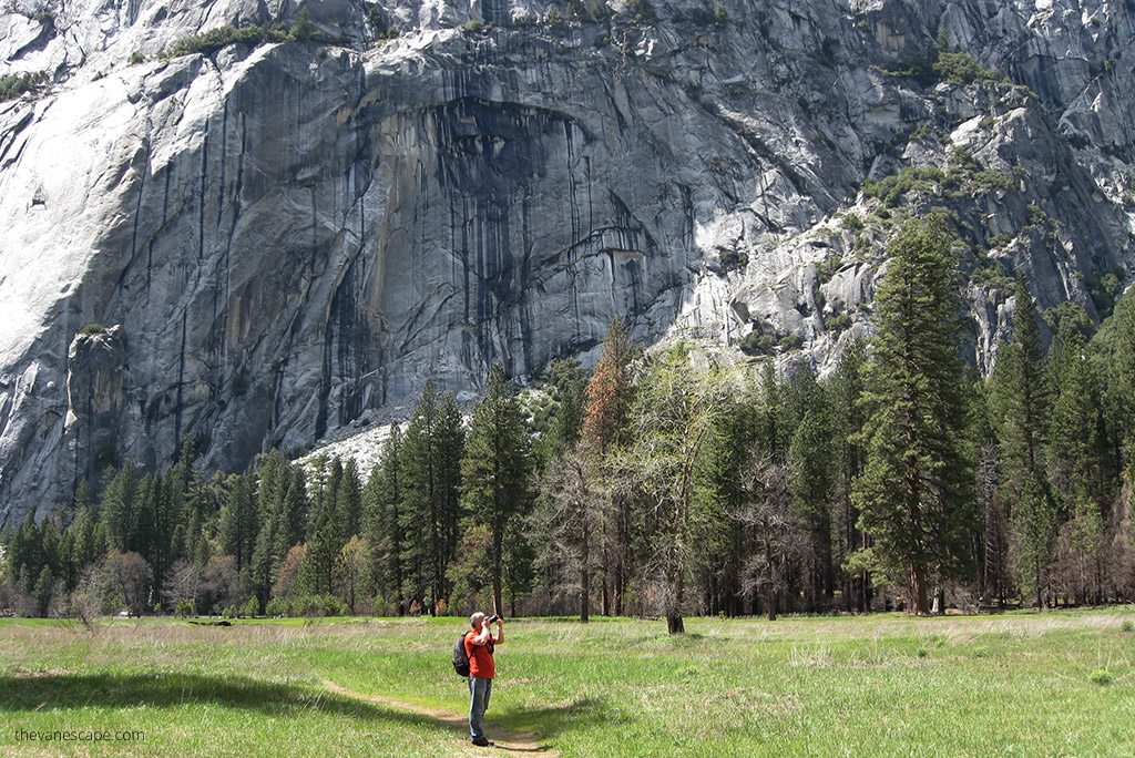 Chris Labanowski, co-owner of the van escape blog, is taking pictures from the hiking trail in yosemite valley.