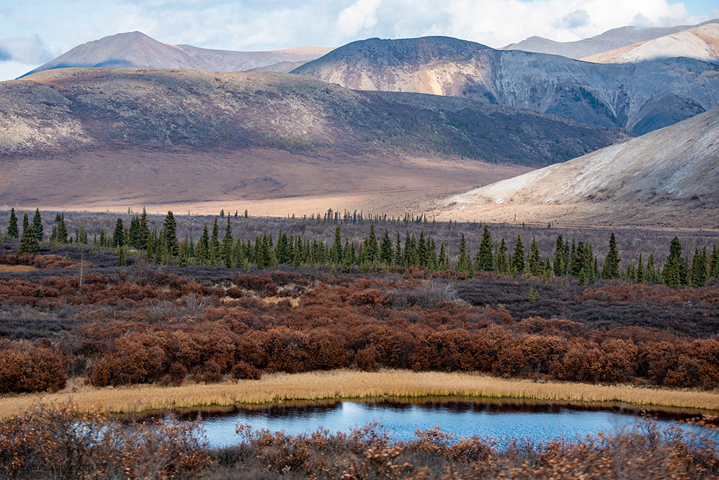 Must-see stops on Dempster Highway: mountain scenery and lake in fall colors.