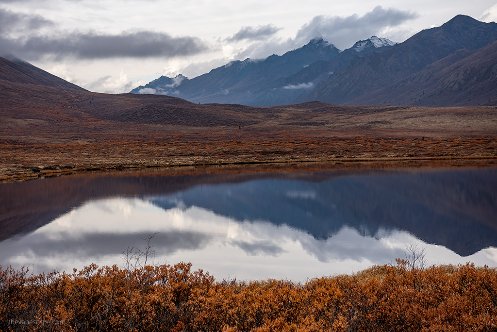 Must-see stops on Dempster Highway: mountain reflection in lake.