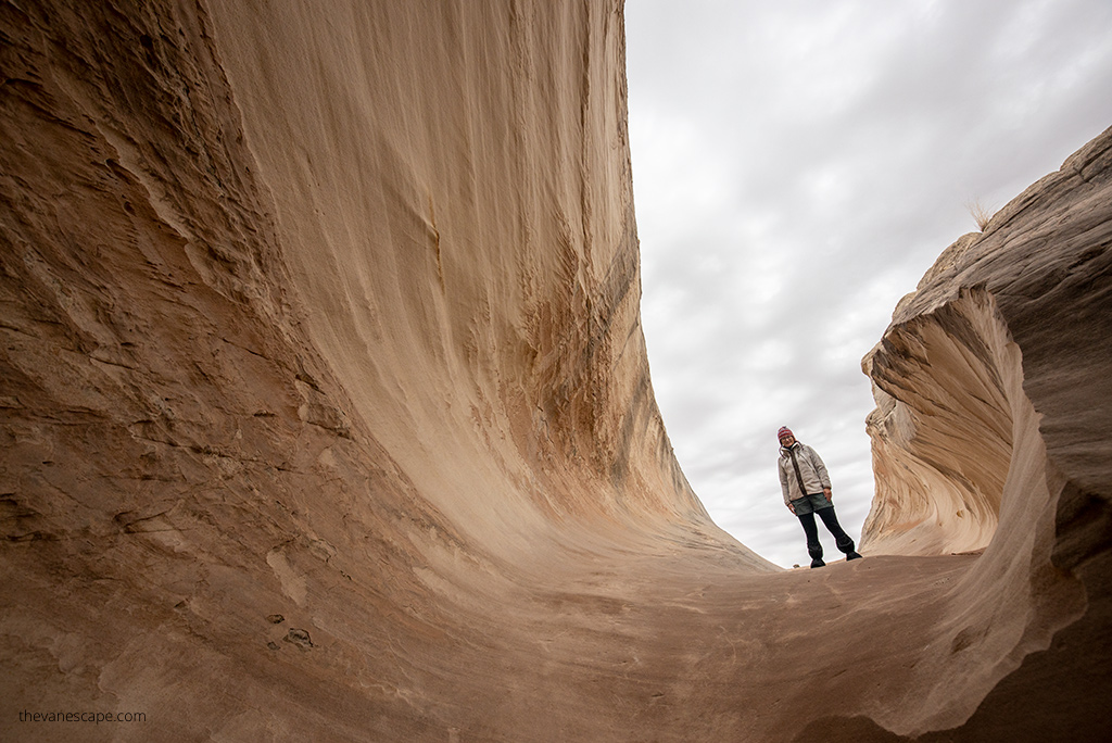 Agnes in Fleece Flight Jacket on a hiking trail.