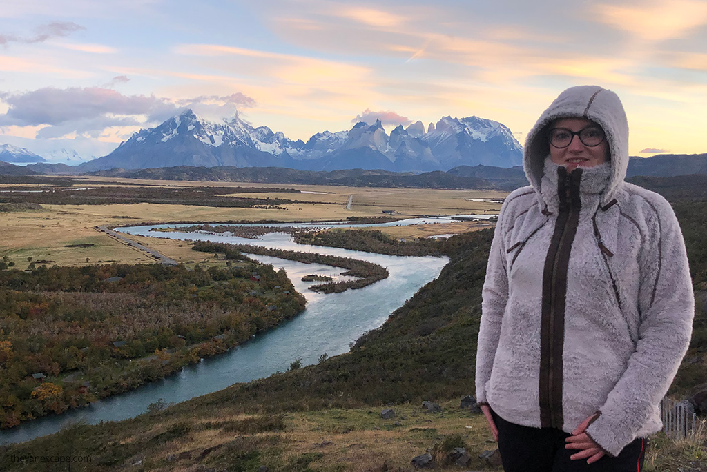 Agnes Stabinska, the author in KUHL Flight Jacket in Argentina, with the river and mountains in the backdrop.