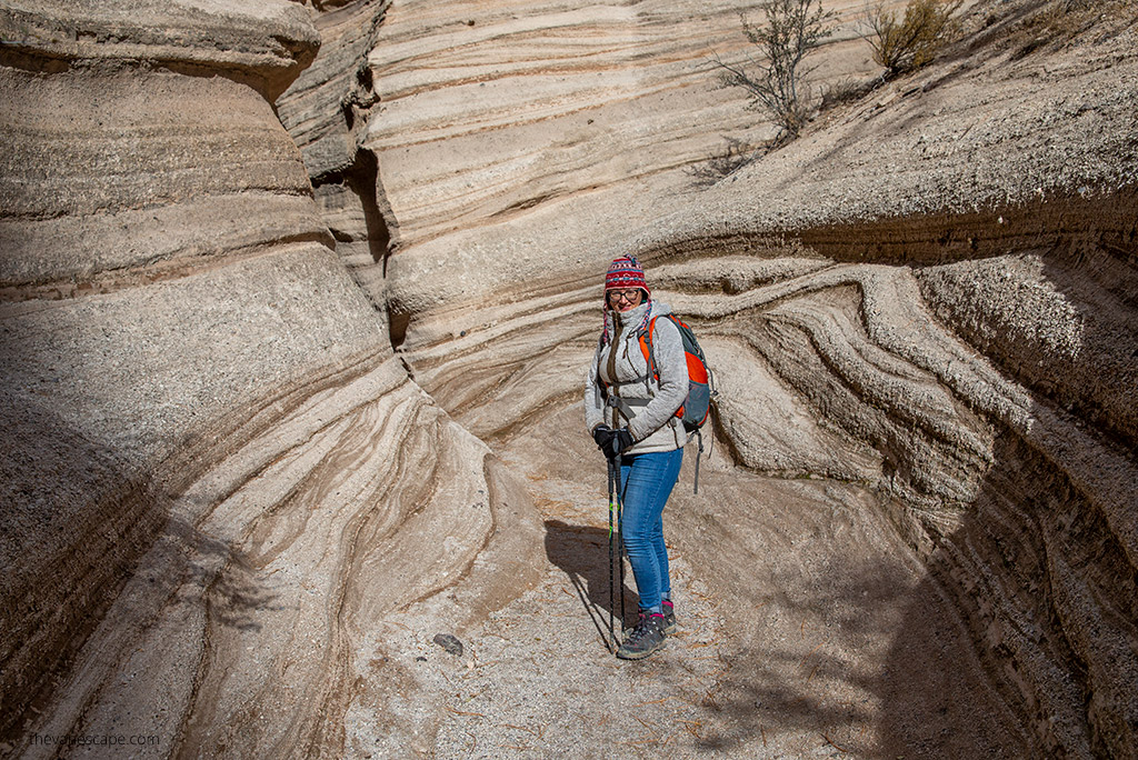 Agnes on a hiking trail in slot canyoon in New Mexico in KUHL Flight Jacket.