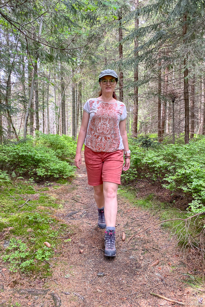 Agnes Stabinska in KUHL KULTIVATR Women's Shorts and hiking boots in the forest.