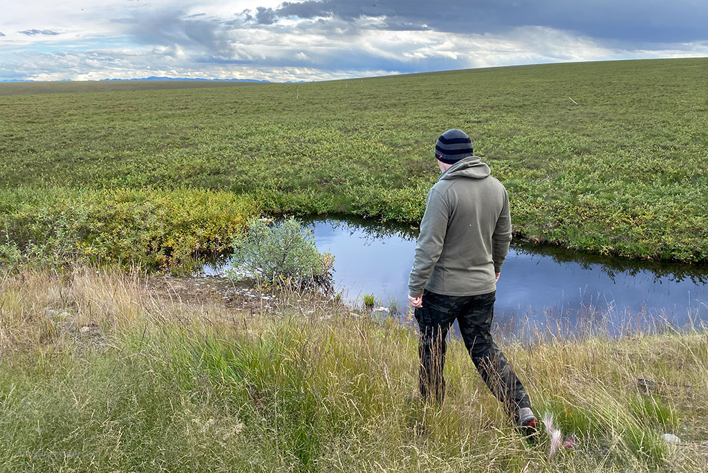 Chris Labanowski, co-founder of the Van Escape blog, is hiking in Alaska in pants by Kuhl.