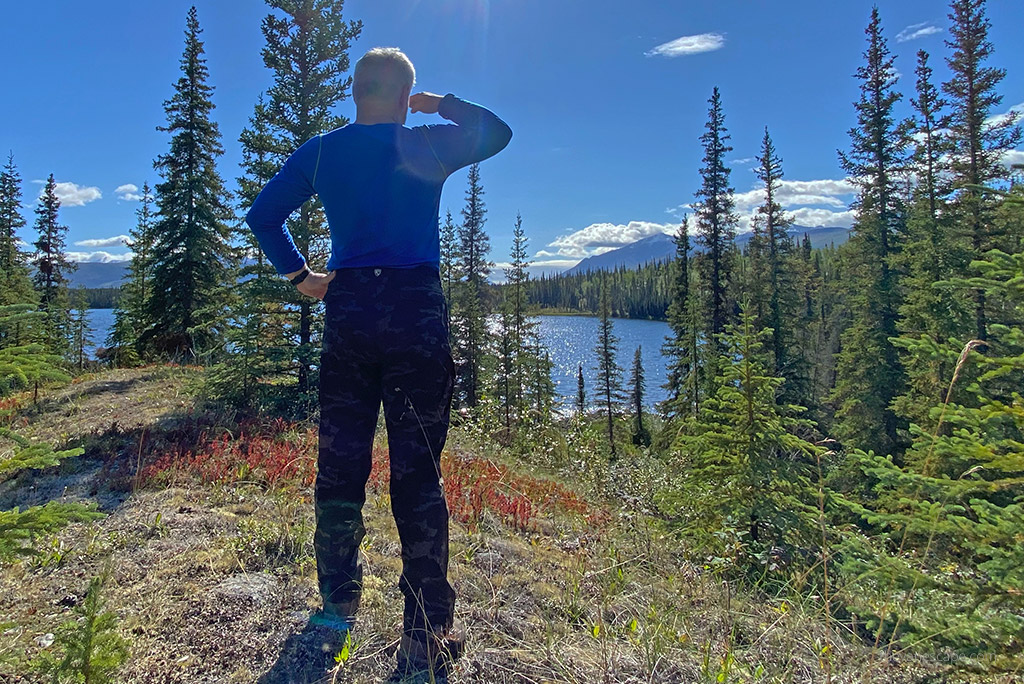 Chris on hiking trail in ALaska in pants by Kuhl.