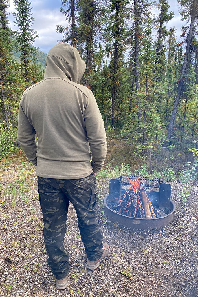 Chris next to campfire in KUHL SILENCR ROGUE KARGO PANT.