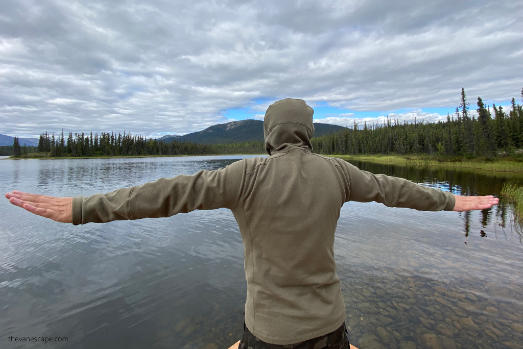 Chris in hoodie by Kuhl at the lake in Gates of the Arctic National Park.