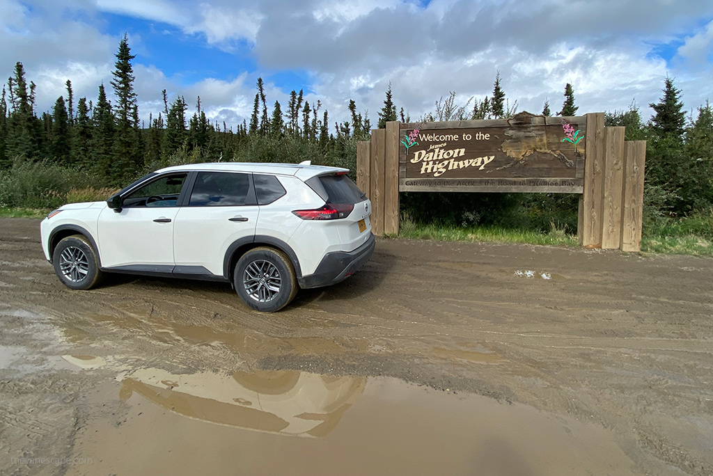 our rented car with the sign of Dalton Highway.