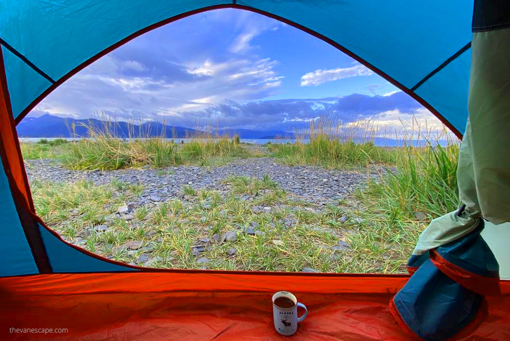 car camping checklist: the morning view from our tent: mountains and the sea.