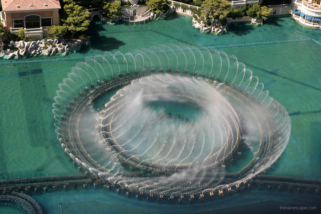 Stunning fountains view from Eiffel Tower Viewing Deck: blue water and cascades of fountains.