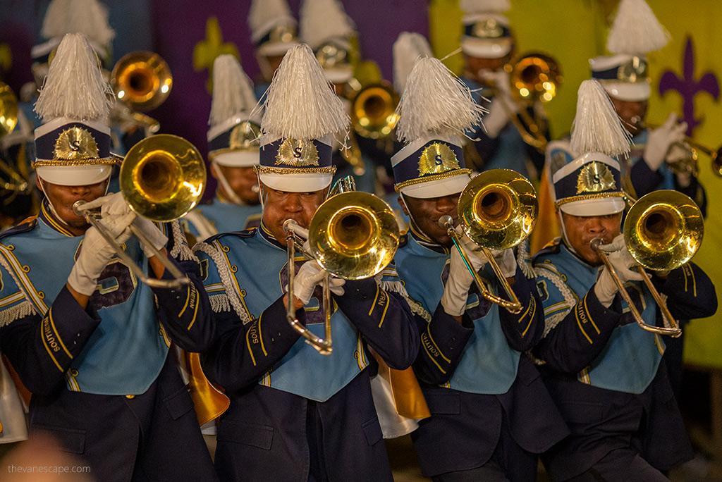 Marching band parade marching through the city during the Mardi Gras carnival in New Orleans.