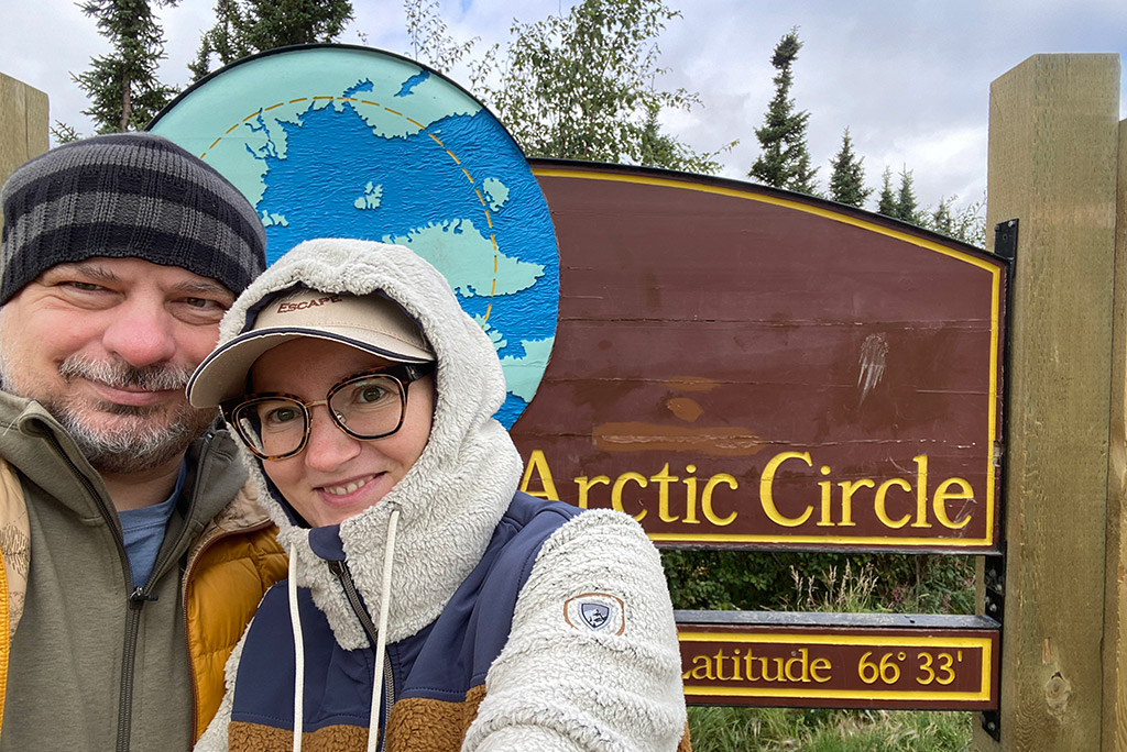 Agnes and Chris on the Arctic Circle on Dalton Highway Alaska