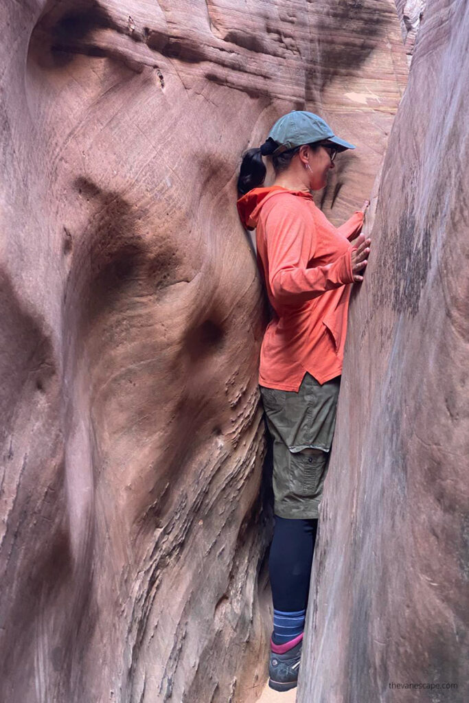 Agnes Stabinska, the author, is squeezing Zebra Slot Canyon in Utah