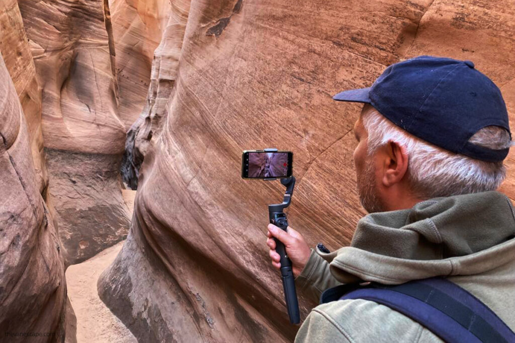 Chris filming narrows walls in Zebra Slot Canyon.