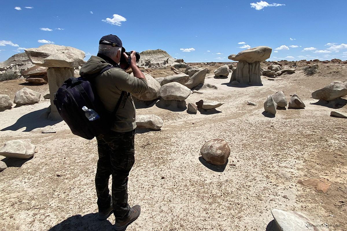 Chris taking pictures of delicate rock formations.